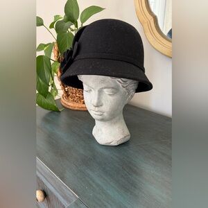 Sakkas Vintage Style Black wool Cloche hat with flower accent.